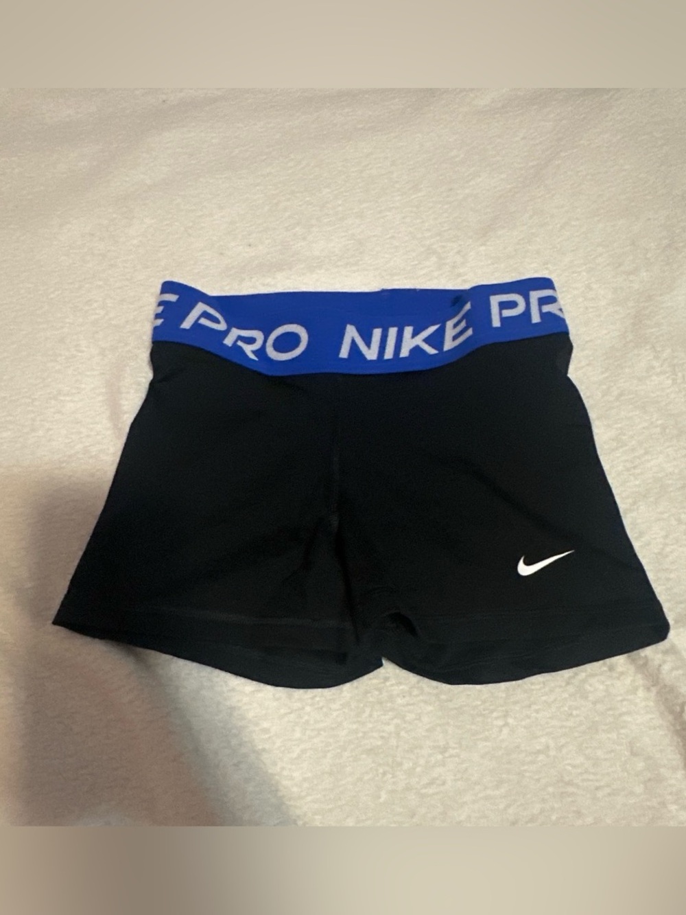 Nike Pro Women's Black Performance Shorts with Blue Waistband, 2 in inseam